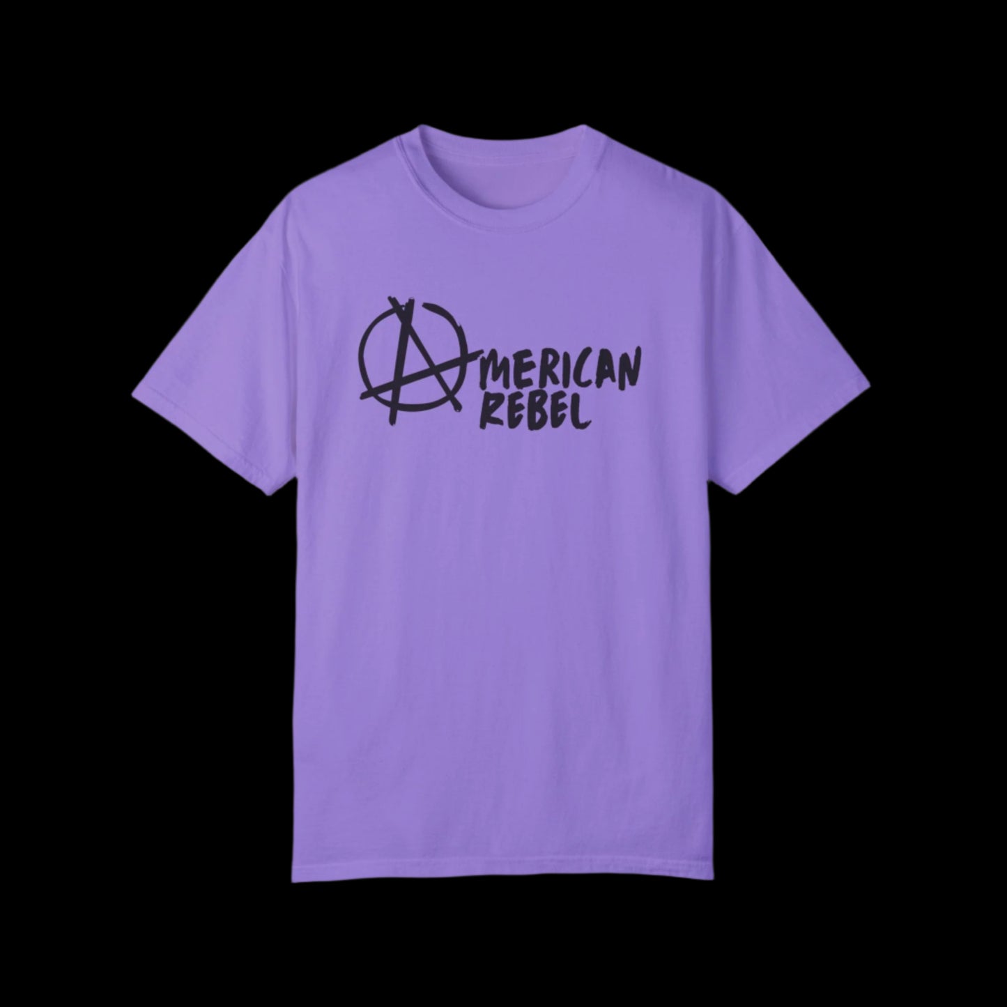 A violet purple t-shirt made from 100% cotton showcases the text American Rebel in black, complemented by an anarchy symbol. Part of the American Rebel Brand, it exudes a vintage look while being displayed against a black background.
