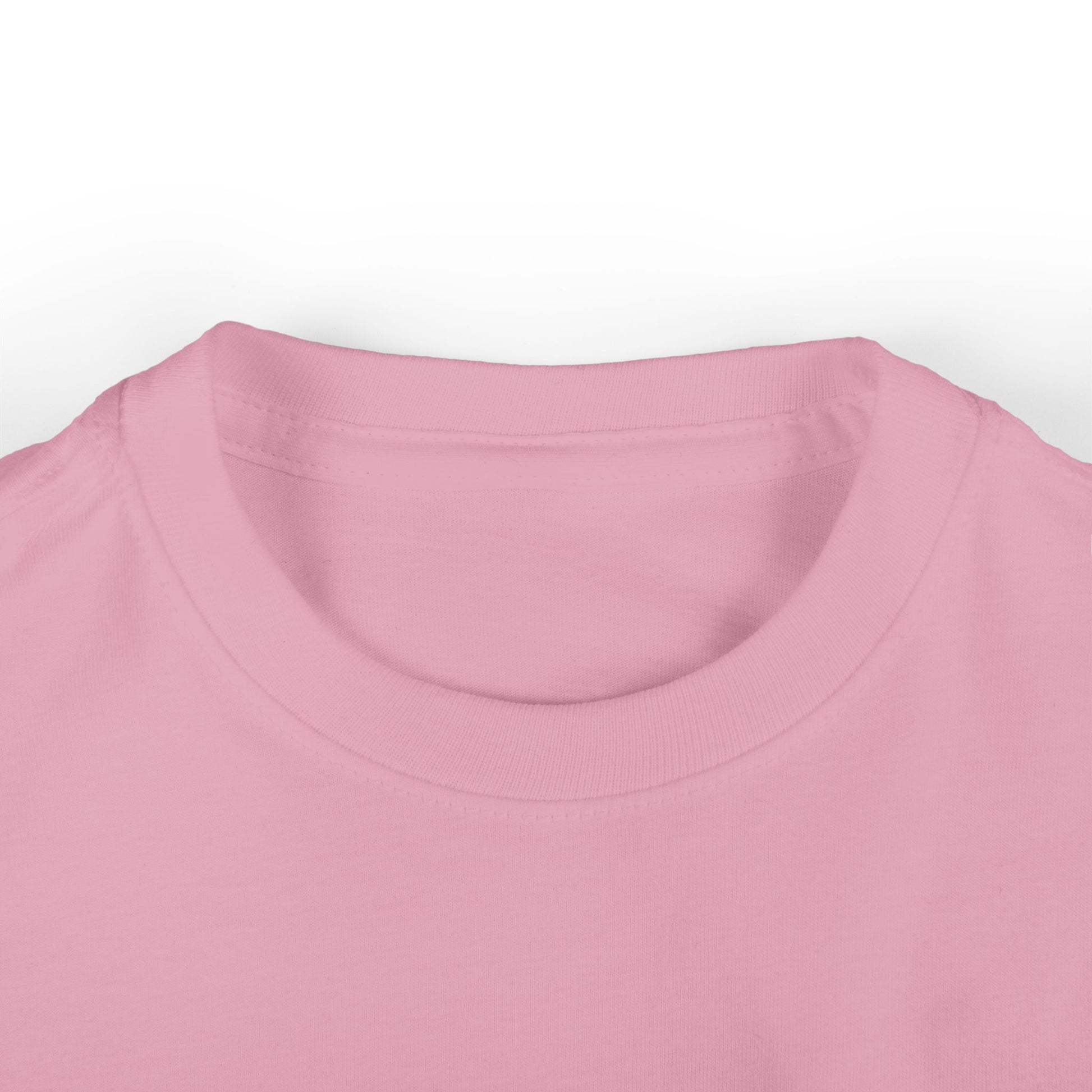 Close-up of an infant tee in soft pink cotton on a white background, highlighting the round neckline and fabric texture.