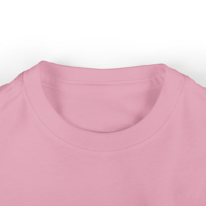 Close-up of an infant tee in soft pink cotton on a white background, highlighting the round neckline and fabric texture.