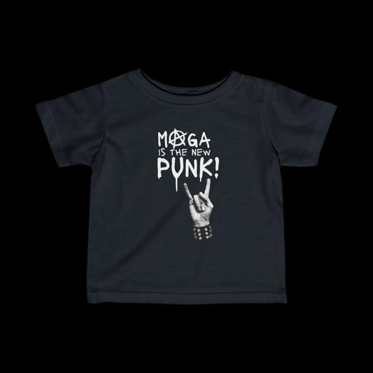 This black jersey toddler t-shirt, made from 100% cotton, features a white design with a star inside a circle, the text MOGA IS THE NEW PUNK!, and an illustration of a hand making a rock sign with a studded bracelet. Perfect for your little rebel, the Punk-Infant Tee stands out on any black background.