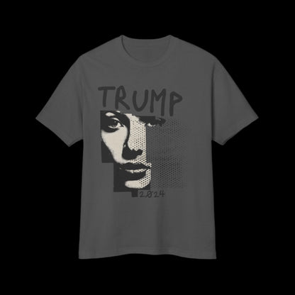 This 80's vintage black faded t-shirt, crafted from 100% cotton, features a black faded design with a stylized image of a women's face and TRUMP 2024 above. The mix of pixelated and solid elements adds to its modern yet nostalgic appeal.