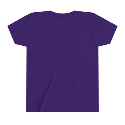 The image showcases a plain, dark purple youth tee made from 100% cotton. Laid flat, the shirts back is visible with short sleeves and a straightforward design without any logos or patterns.