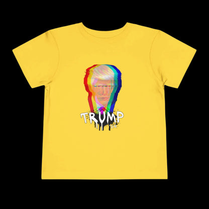 Yellow cotton tee featuring a glitch-style graphic of a persons face and the word TRUMP below, enhanced by a dripping paint effect. The black background makes it perfect for stylish toddlers.