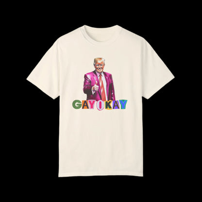 This unisex cotton t-shirt showcases a colorful illustration of a man in a suit giving a thumbs-up. Below him, the vibrant text GAY OKAY celebrates LGBTQ pride against a black background.