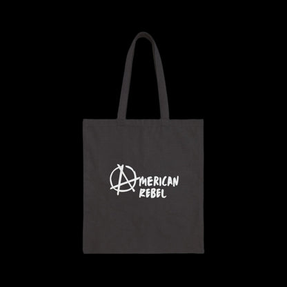 A black cotton canvas tote bag proudly displaying American Rebel in white, with the letter A artistically styled as the anarchist symbol.