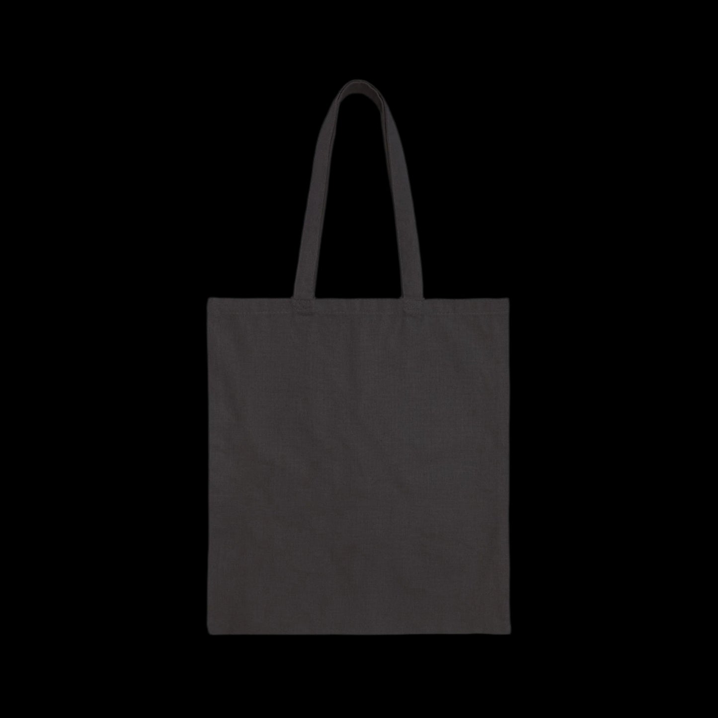 A sleek Cotton Canvas Tote Bag with two shoulder straps stands against a solid black background. This versatile bag, perfect for the conscientious shopper, is crafted from durable fabric and currently sits empty, awaiting your essentials.