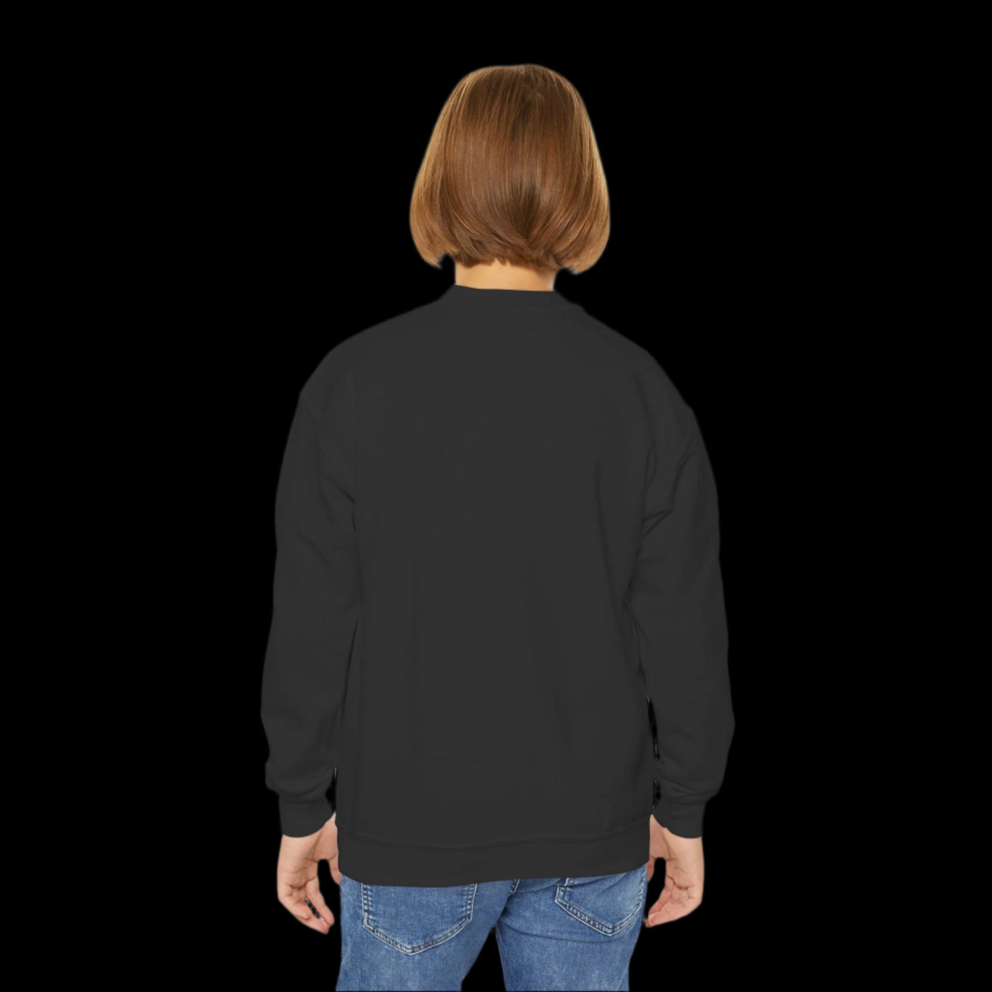 A kid with short hair, wearing a black sweatshirt and blue jeans, stands with their back to the camera against a plain white background, embodying a quiet commitment to a toxic-free environment.