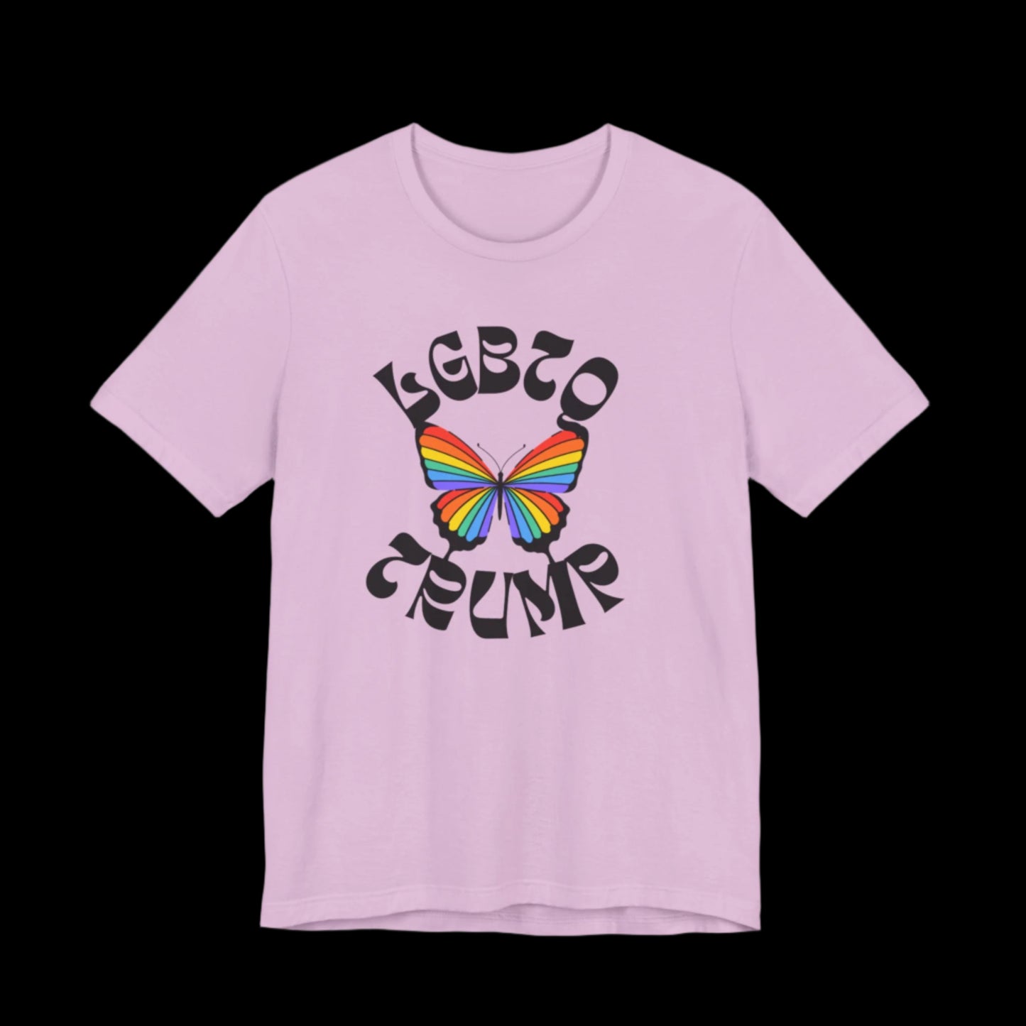 This unisex T-shirt boasts a lilac hue and showcases a rainbow-colored butterfly in the center. Above and below, LGBTQ TRUMP is boldly displayed in stylized letters, contrasted against a solid black background to highlight its vibrant design.