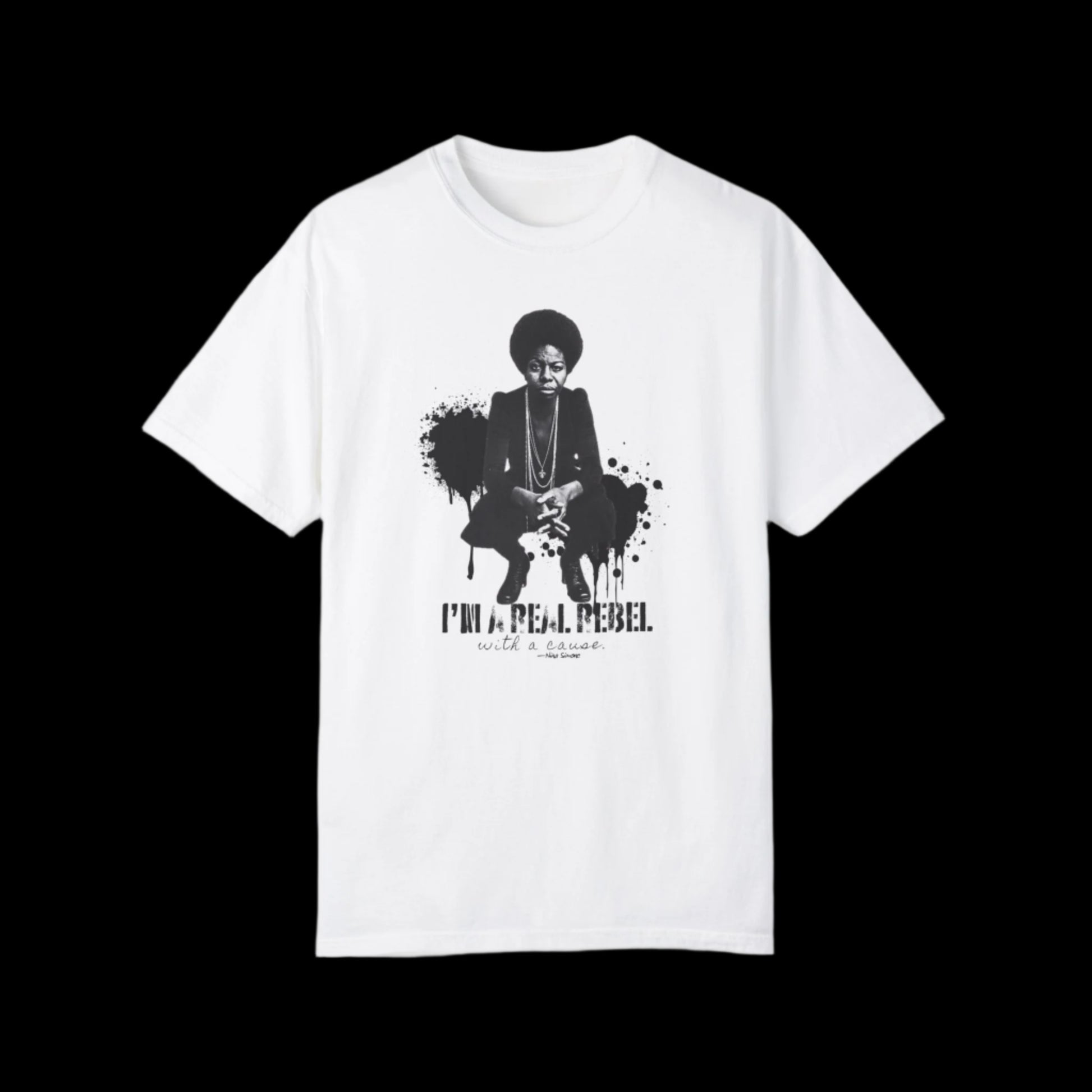 This unisex T-shirt boasts a vintage look with a monochrome graphic of Nina Simone squatting with her hands crossed, accompanied by the text I'm a rebel with a cause below. Black paint splashed in the backgroud. Inspired by fans of Nina Simone, the graffiti art design stands boldly against the black background.