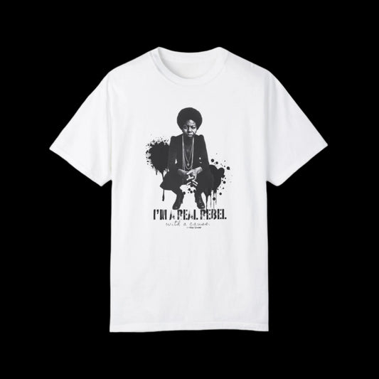 This unisex T-shirt boasts a vintage look with a monochrome graphic of Nina Simone squatting with her hands crossed, accompanied by the text I'm a rebel with a cause below. Black paint splashed in the backgroud. Inspired by fans of Nina Simone, the graffiti art design stands boldly against the black background.