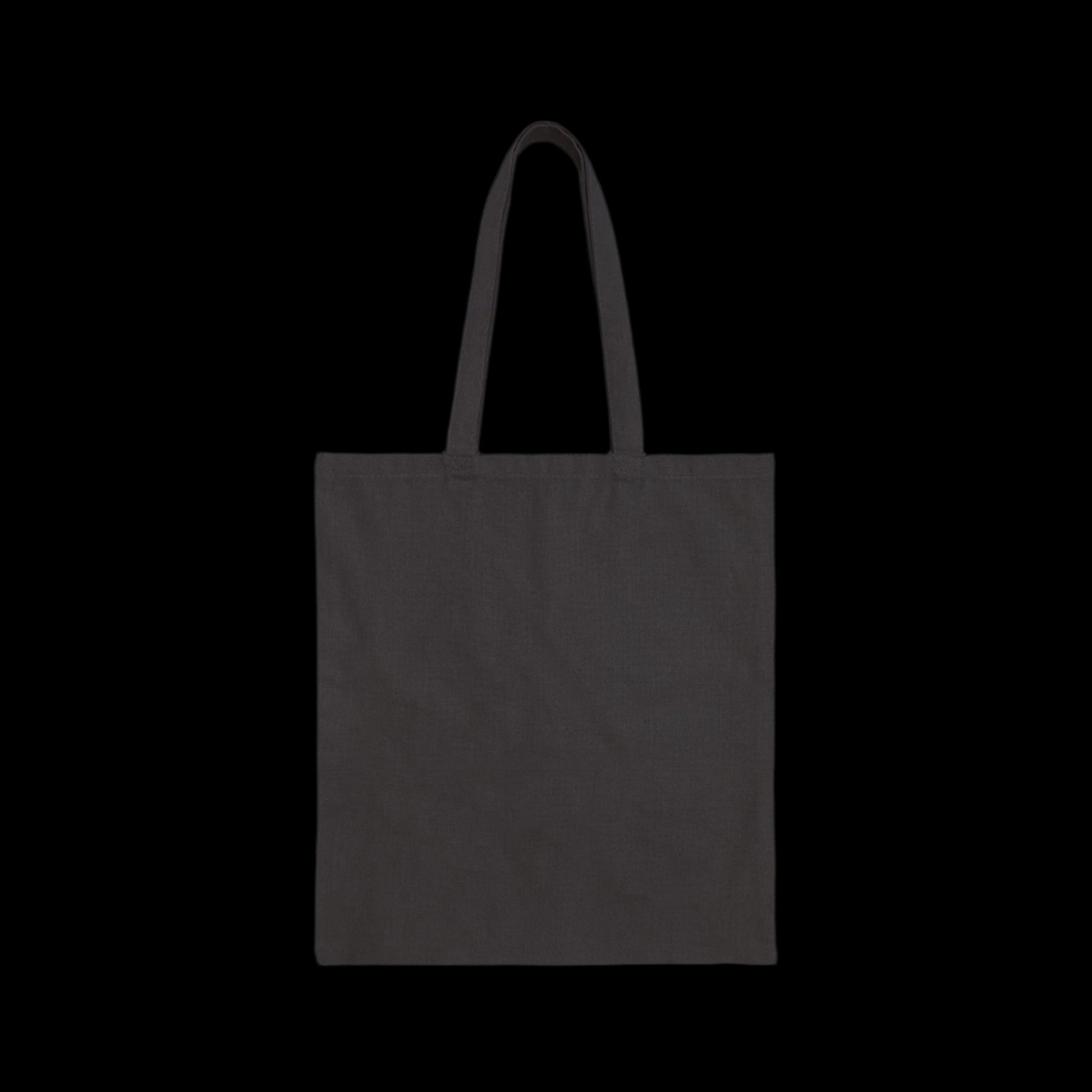 A plain black cotton canvas tote bag with two handles, set against a solid black background. The American Rebel design exudes simplicity and minimalism, perfect for any occasion.