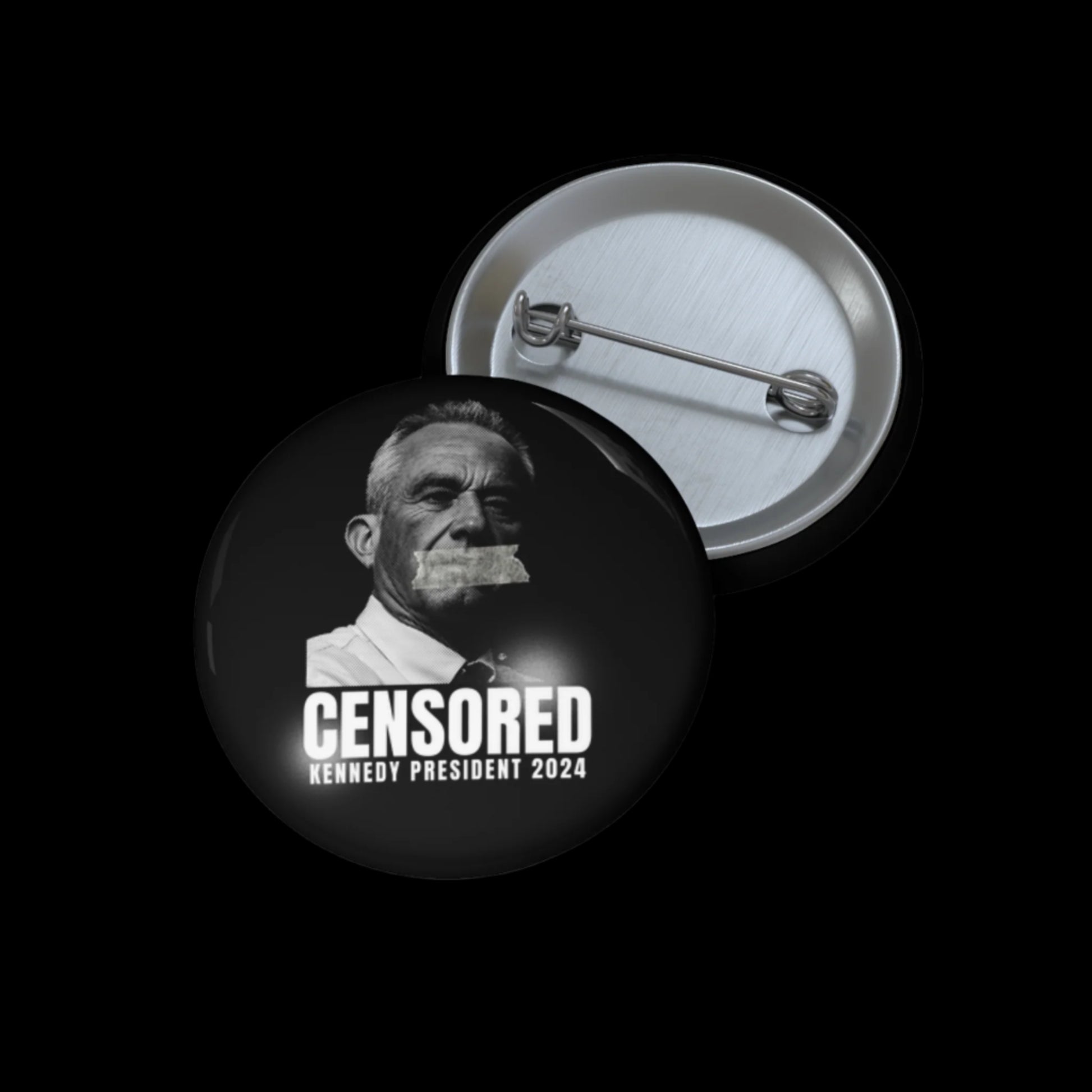 A pin button displays a black-and-white image of RFK Jr. with tape over his mouth, captioned KENNEDY CENSORED. Below, it reads KENNEDY PRESIDENT 2024. The reverse side features a visible pin for attaching.