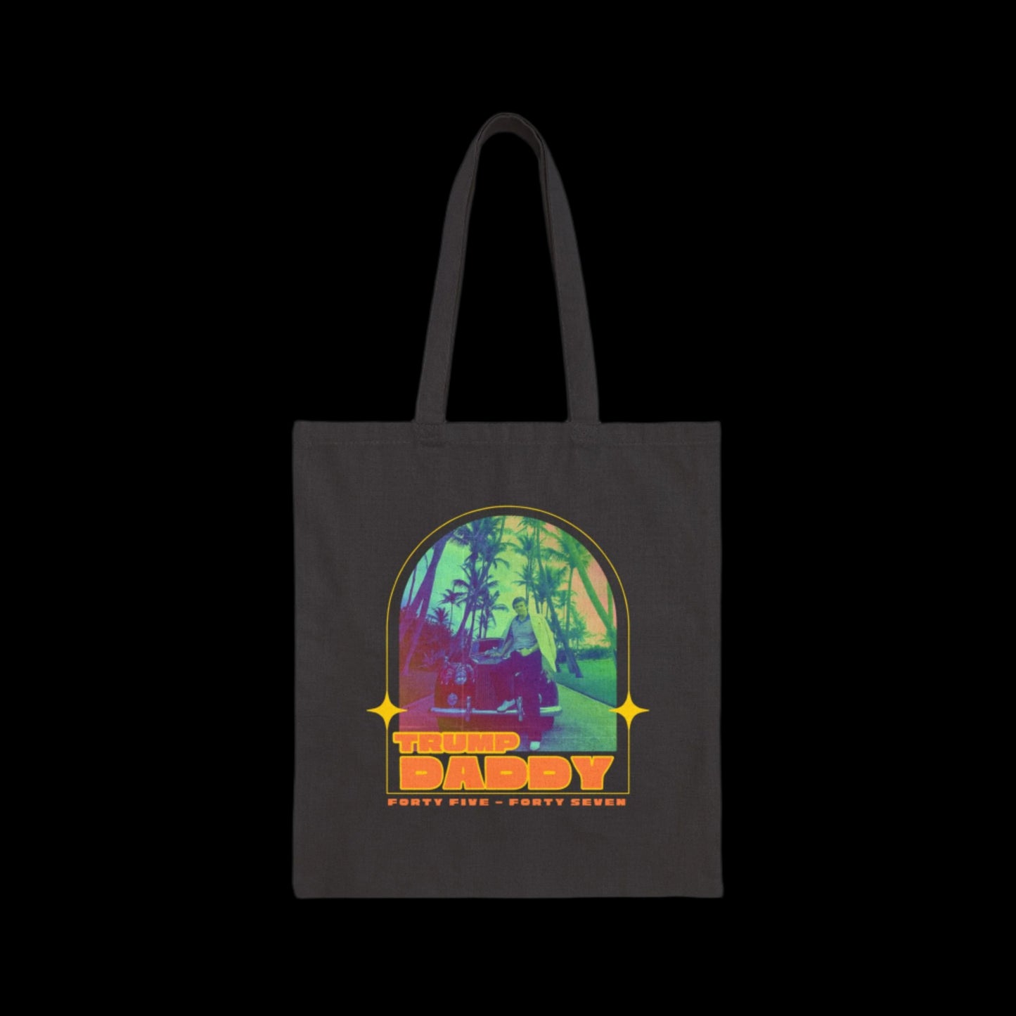 A black retro tote bag with a colorful design showcasing Donald Trump, palm trees, a car and a sunset. The bold text reads Trump Daddy and Forty Five - Forty Seven, giving it a vintage flair.