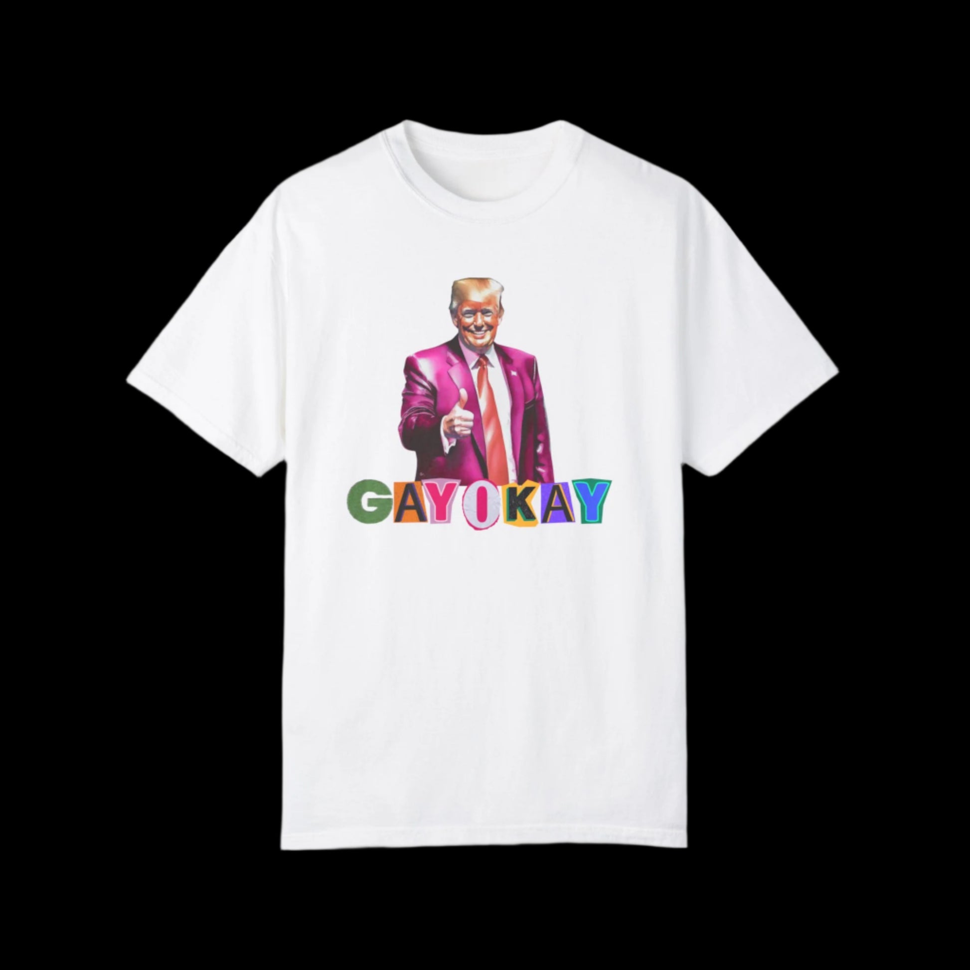 This unisex cotton T-shirt showcases an illustration of a figure in a pink suit giving a thumbs-up. Beneath the figure, GAY OKAY is emblazoned in vibrant rainbow letters against a black background, celebrating LGBTQ pride with style and comfort.