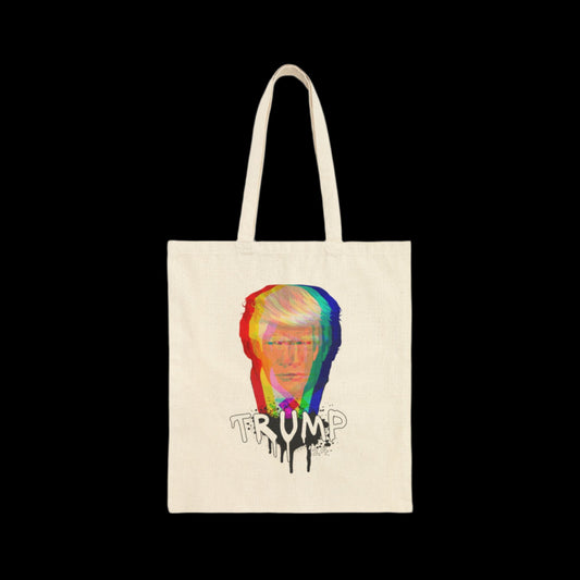 A natural white cotton canvas tote bag featuring graffiti art with a distorted, colorful graphic of Trump's face and the word TRUMP in a spray paint drip font underneath. The solid black background adds striking contrast to the design.