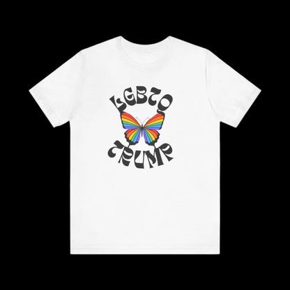 This white unisex T-shirt showcases a rainbow-colored butterfly with LGBTQ TRUMP in bold, stylized black letters encircling the vibrant design.