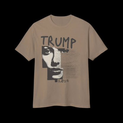 This vintage T-shirt, crafted from 100% cotton, features a stylized black and white portrait on its garment-dyed beige fabric. The text TRUMP appears above the image and 2024 below, set against a striking black background.