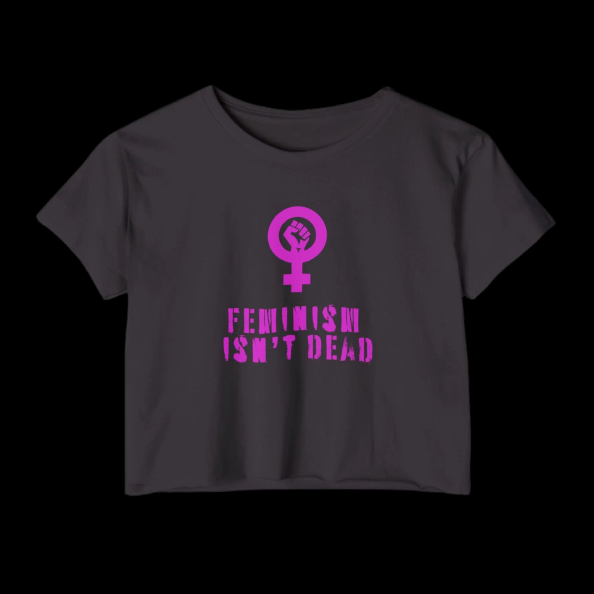 A black crop top featuring a pink feminist symbol with the bold statement Feminism Isnt Dead, this piece makes a powerful declaration for womens rights.