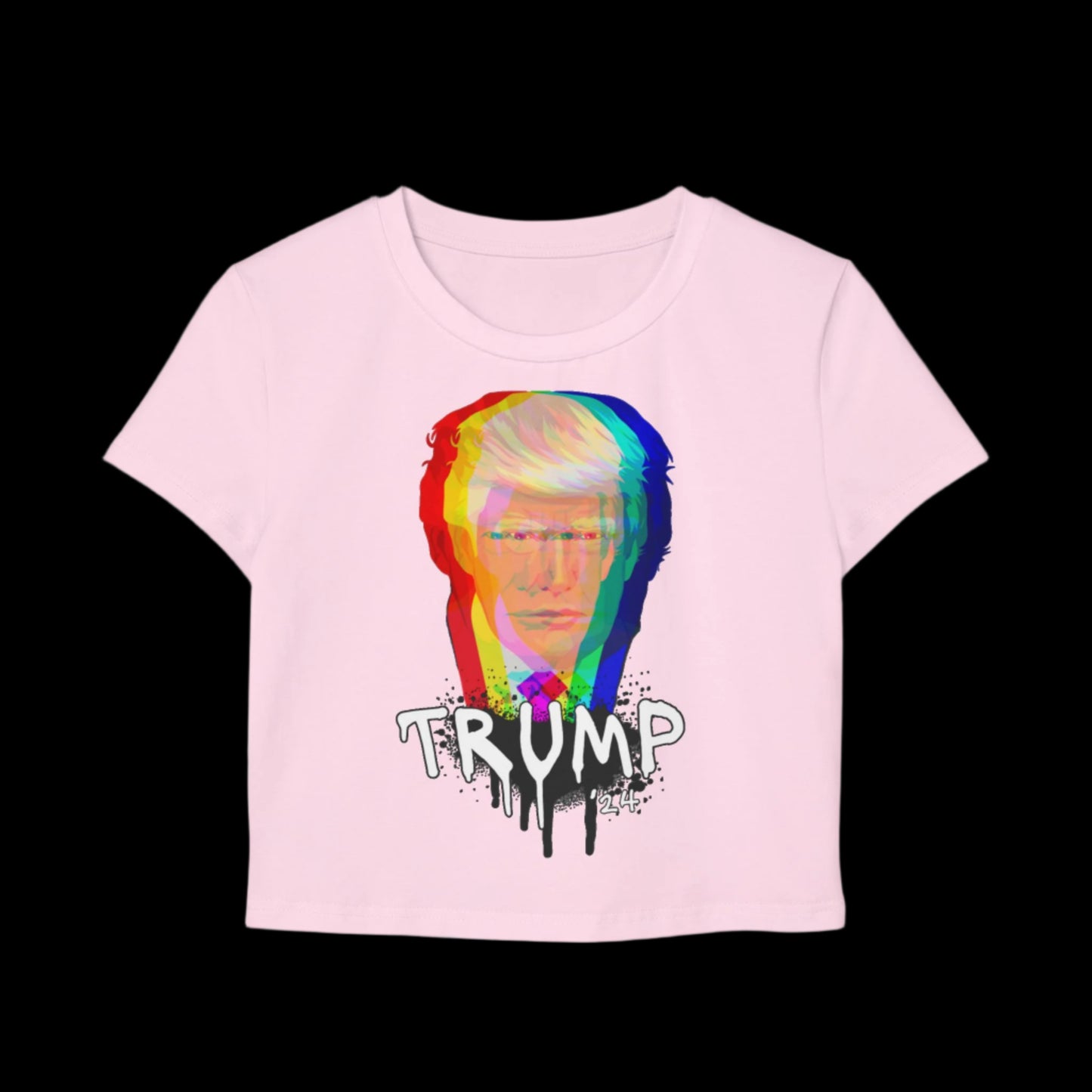 This pink baby tee, crafted from organic cotton, boasts a vibrant abstract design of a person with TRUMP beneath in a stylized, drippy font reminiscent of graffiti art. The solid black background makes the colors pop.